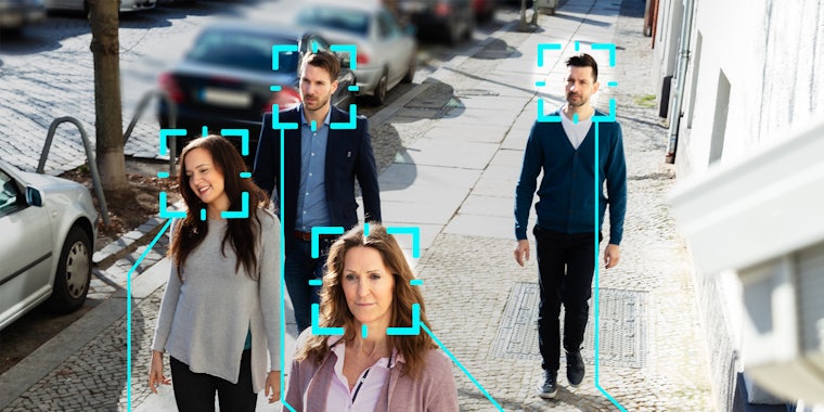People on street with facial recognition overlays on their heads