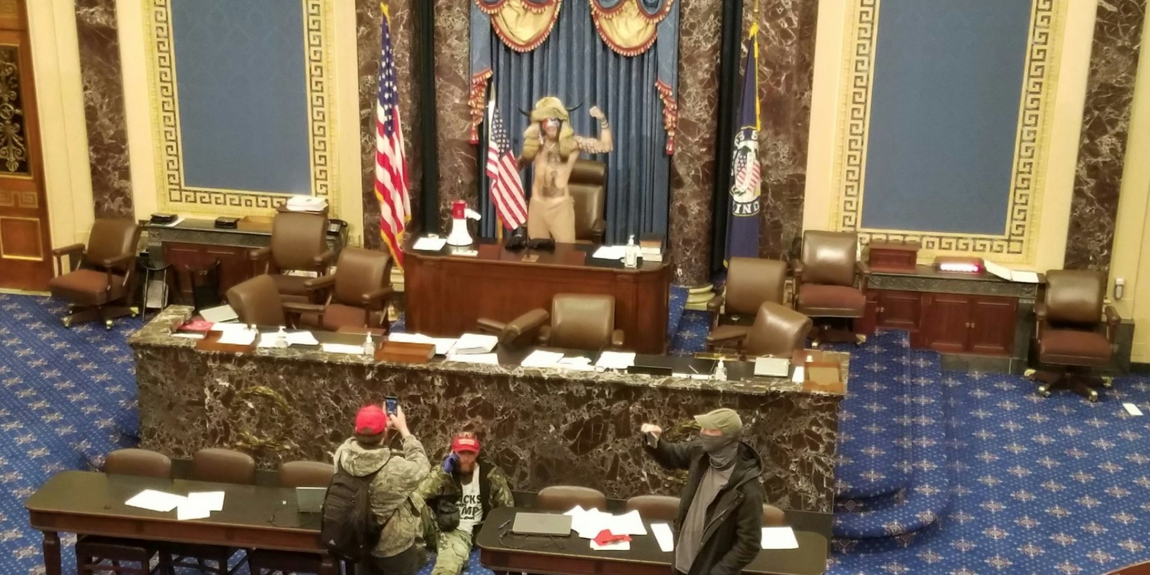 qanon supporter stands in the house of representatives
