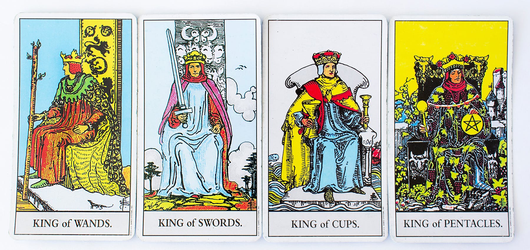 Examples of the Minor Arcana cards, includes an image of the King of wands, King of swords, king of cups, and the king of pentacles.