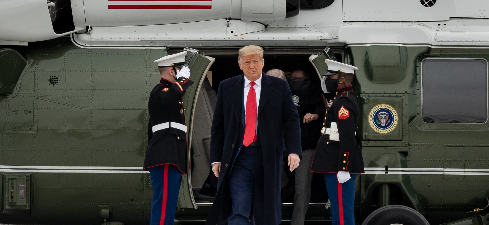 trump walking in front of marine one