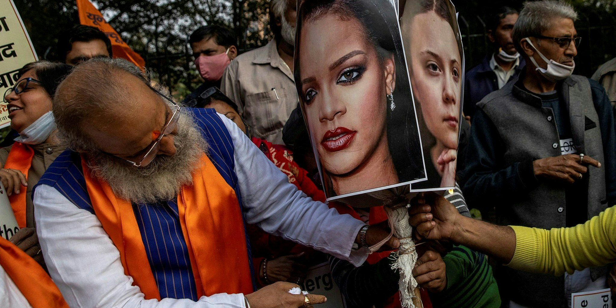 People prepare to burn an effigy of Rihanna and Greta Thunberg