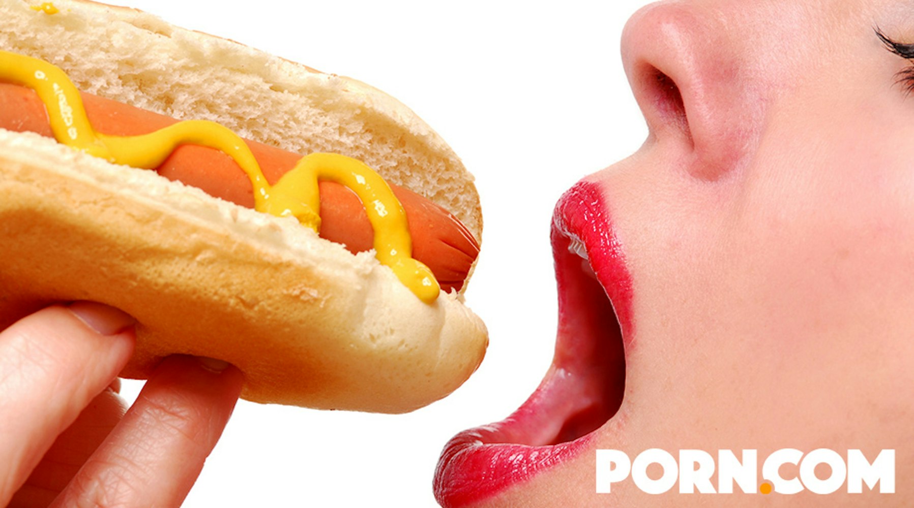Woman eating a hotdog for a porn.com ad