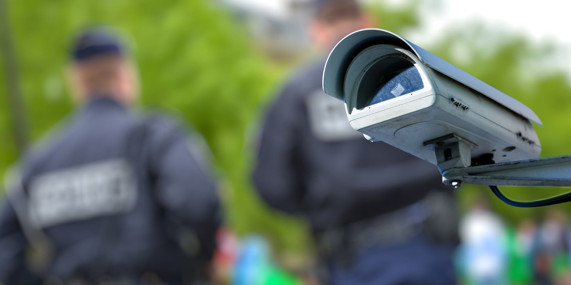 Police and a facial recognition camera.