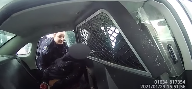 New footage of nine year old pepper sprayed and handcuffed in back of police car