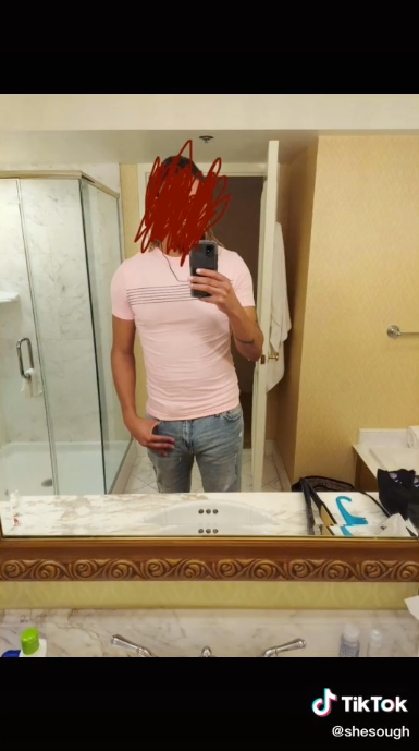 man taking mirror selfie