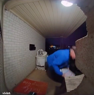 pizza delivery man at customer's front porch placing box of pizza on ledge