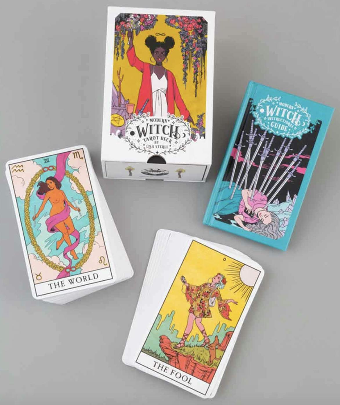 Modern Witch tarot card deck and the manual on a grey background.