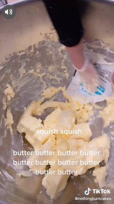 butter being squished in bowl