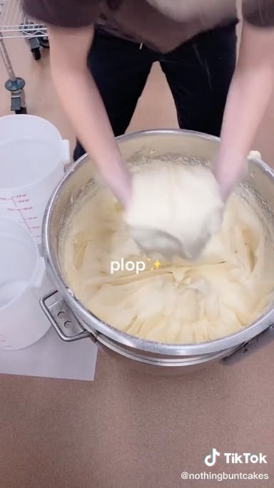 butter being transferred from bowl to containers