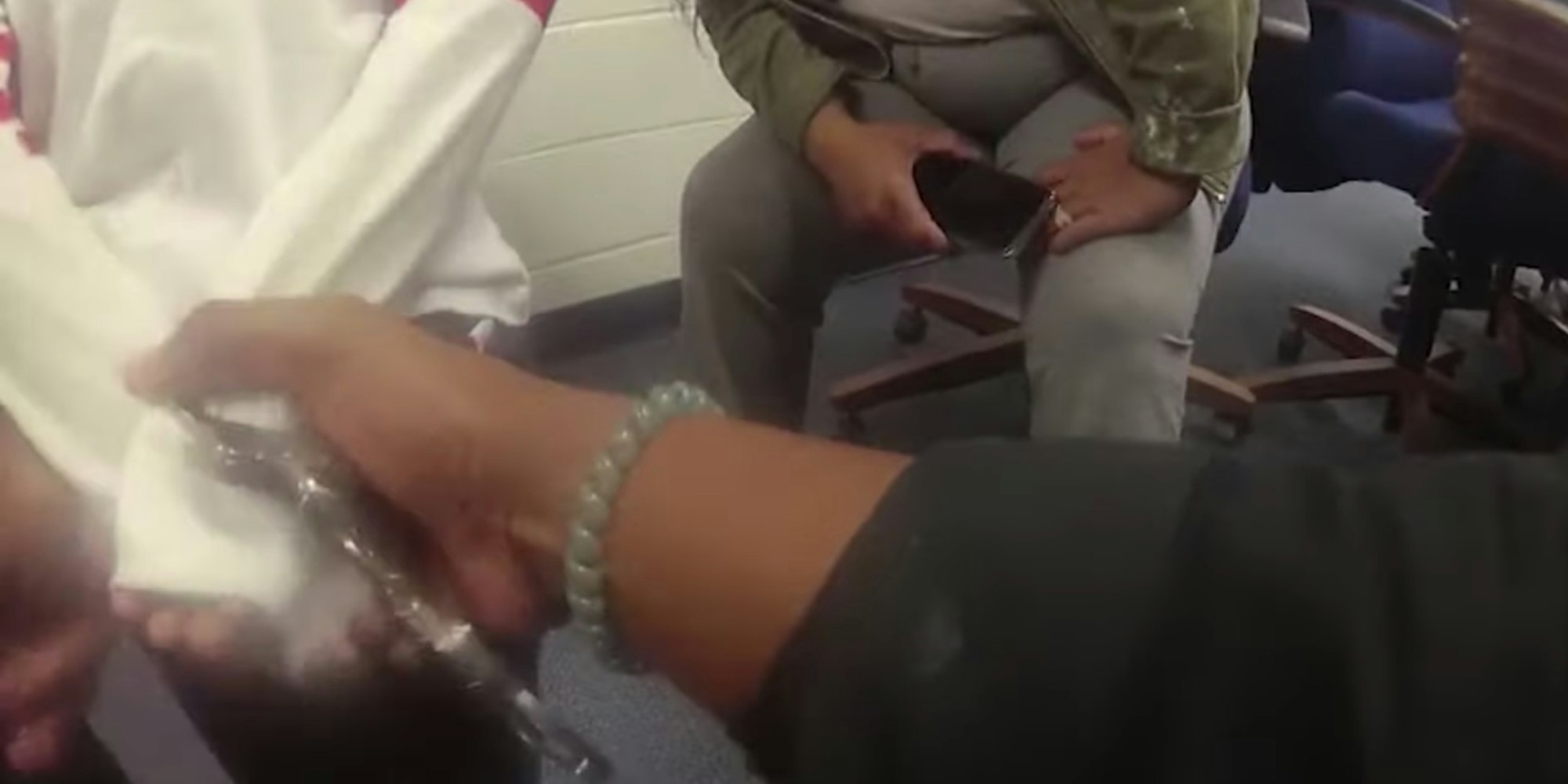 police putting handcuffs on a 5-year-old boy