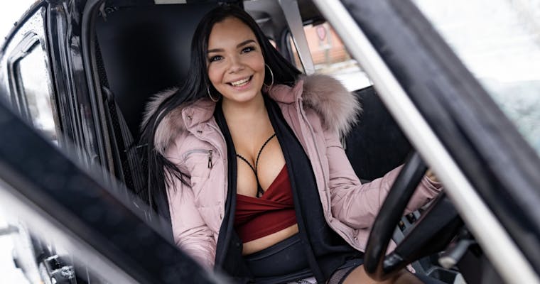 Sofia Lee smiling behind the wheel.