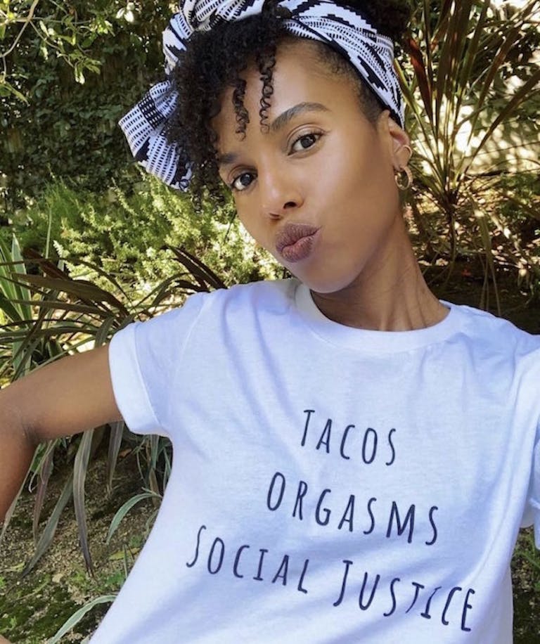 Bellesa t-shirt that says "tacos, orgasms, social justice"