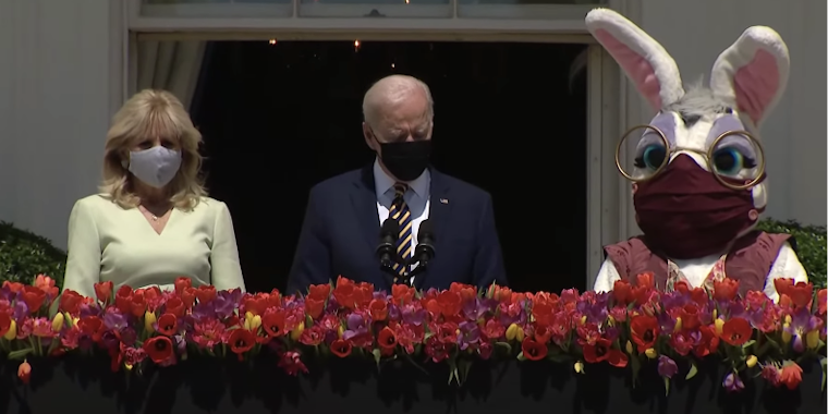 The Bidens stand next to a masked up Easter Bunny