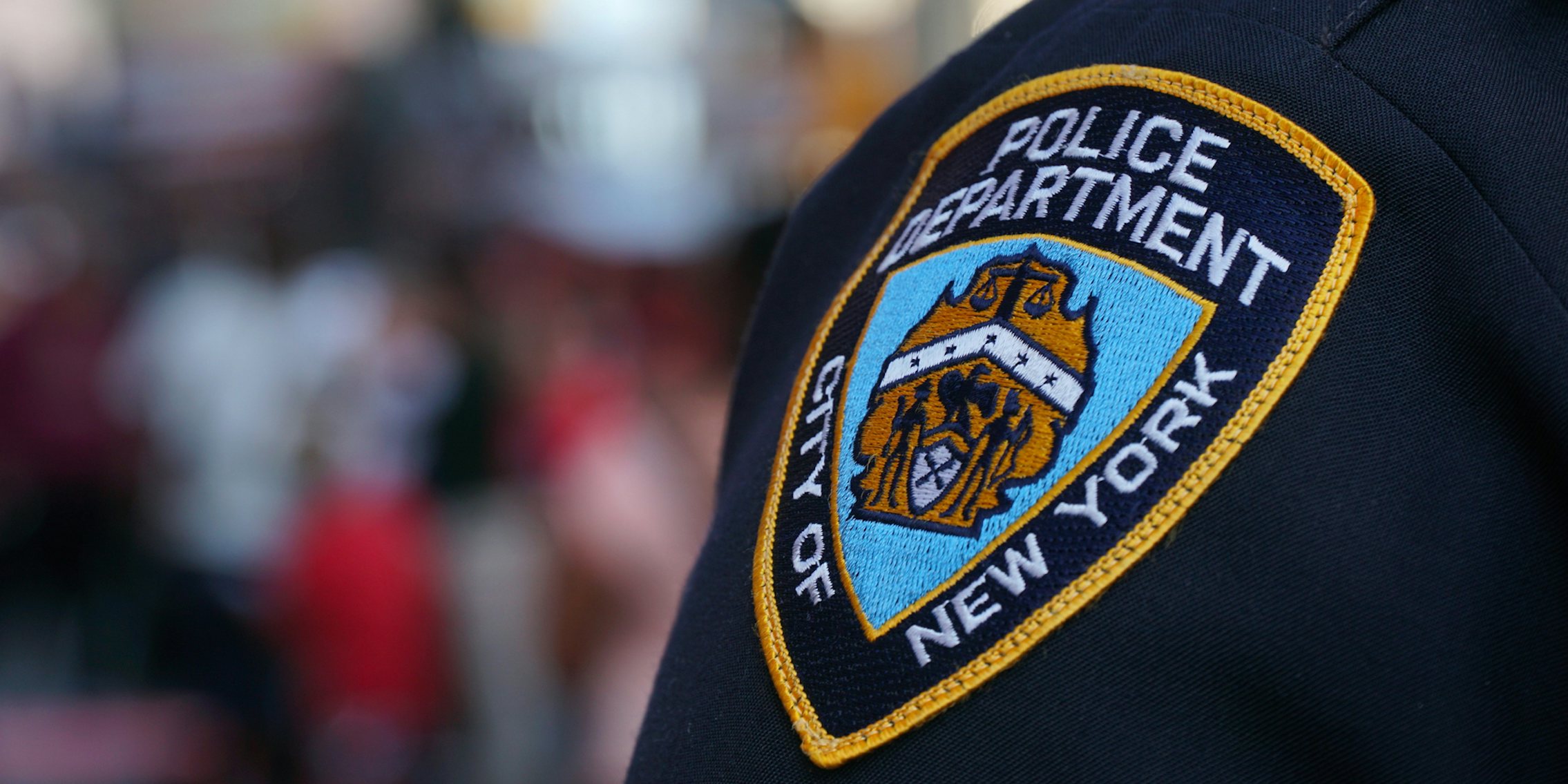 A NYPD badge on the shoulder of a police officer.