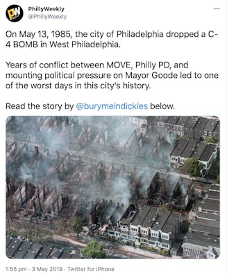 "On May 13, 1985, the city of Philadelphia dropped a C-4 BOMB in West Philadelphia.   Years of conflict between MOVE, Philly PD, and mounting political pressure on Mayor Goode led to one of the worst days in this city’s history.   Read the story by  @burymeindickies  below." aerial photograph of burned out buildings, still smoking