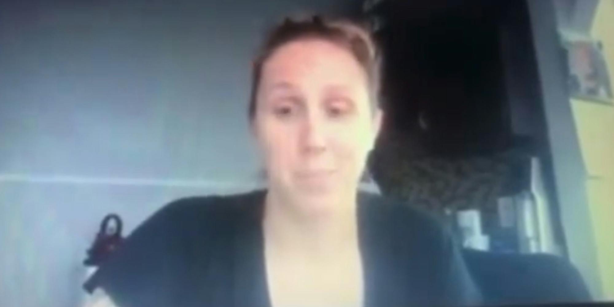 White woman sitting at desk