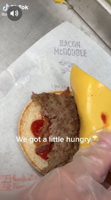half-eaten mcdonald's burger