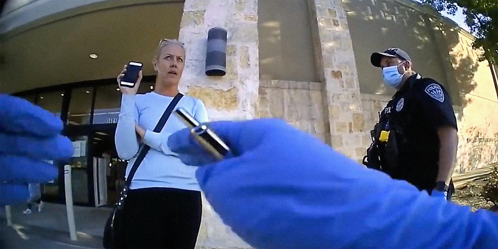 A woman talking to two police officers.