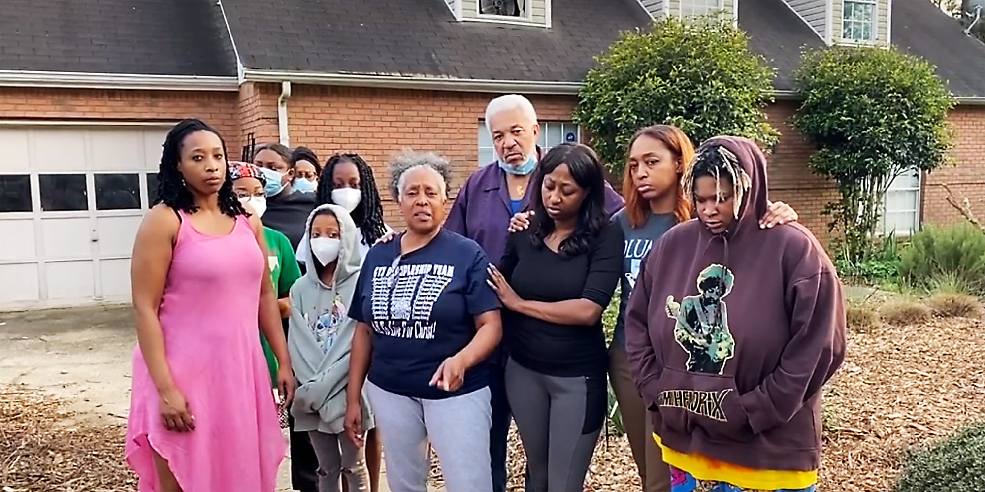 A family in front of their home.