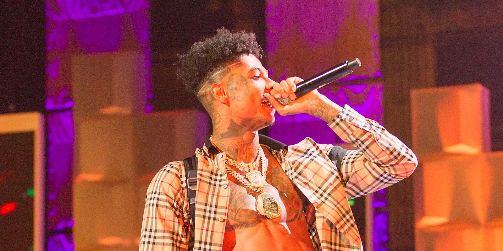 Blueface rapping onstage.