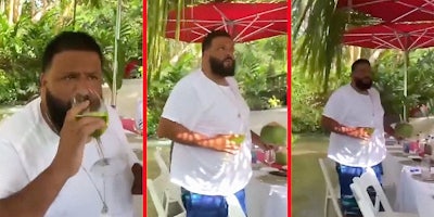 DJ Khaled standing up and looking confused.
