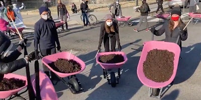 Protestors with wheelbarrows full of shit.