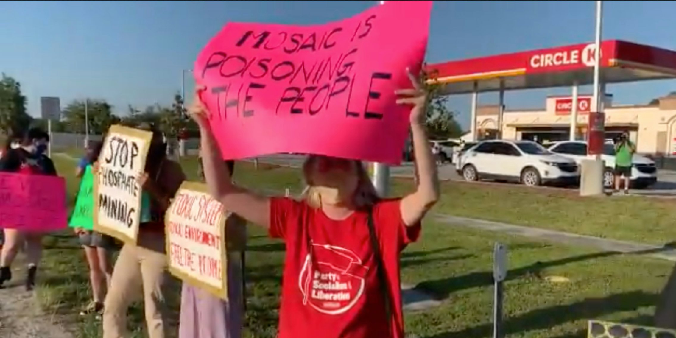 People protesting the handling of a wastewater disaster in Florida