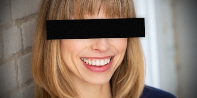 A woman with eyes blacked out.