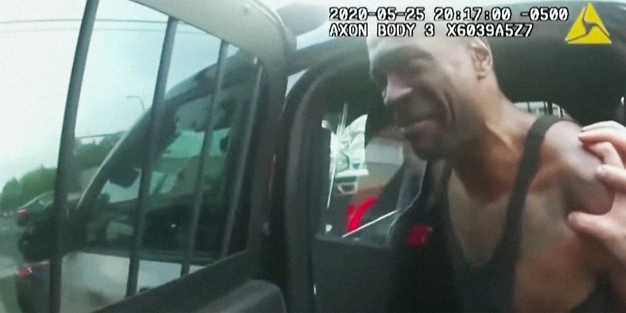 George Floyd in the back of a police car.