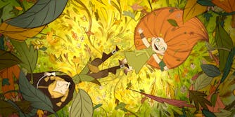 two girls laying in leaves