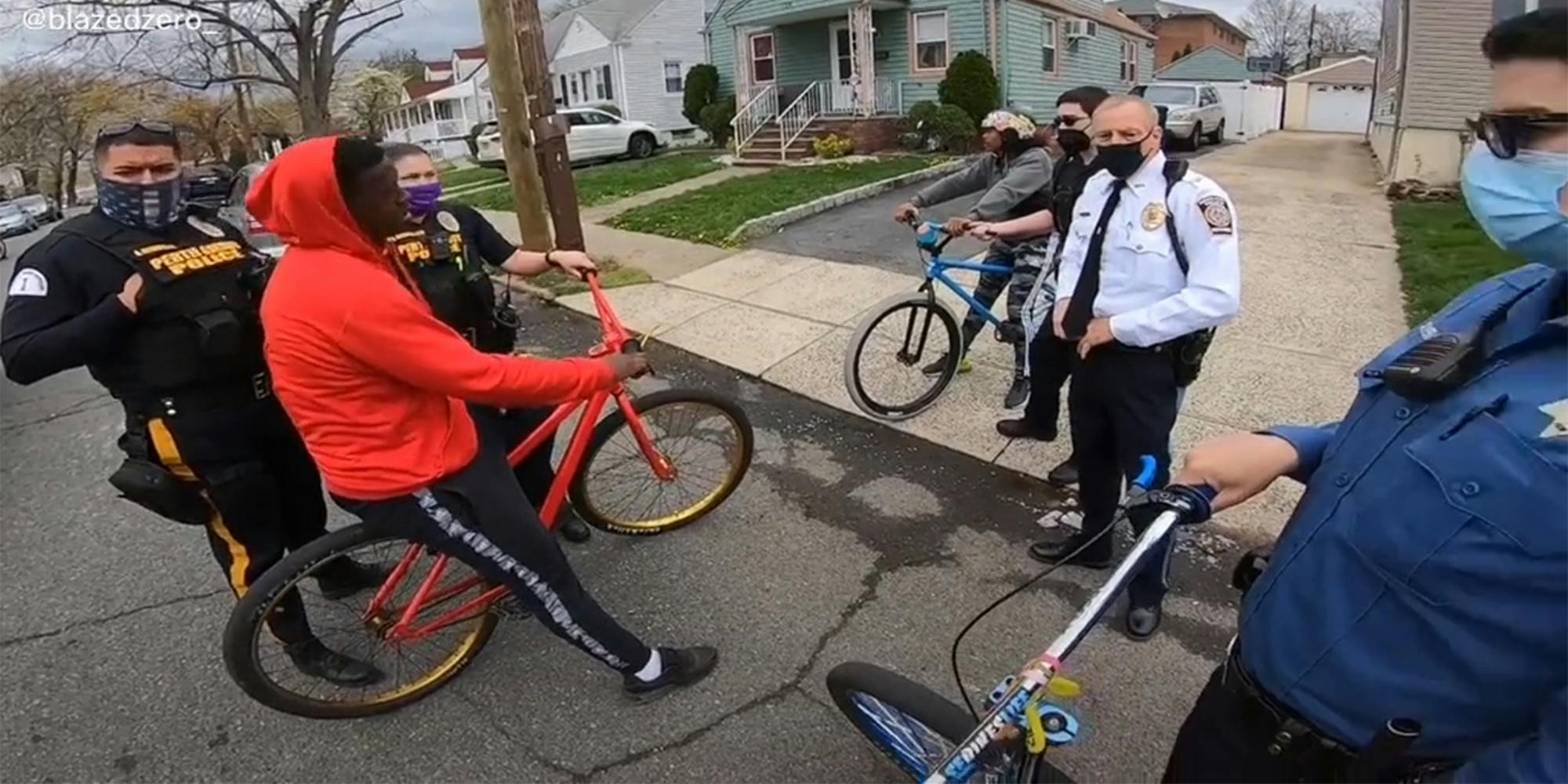 police surround teenagers on bicycles