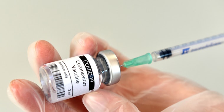 covid 19 vaccine in hand