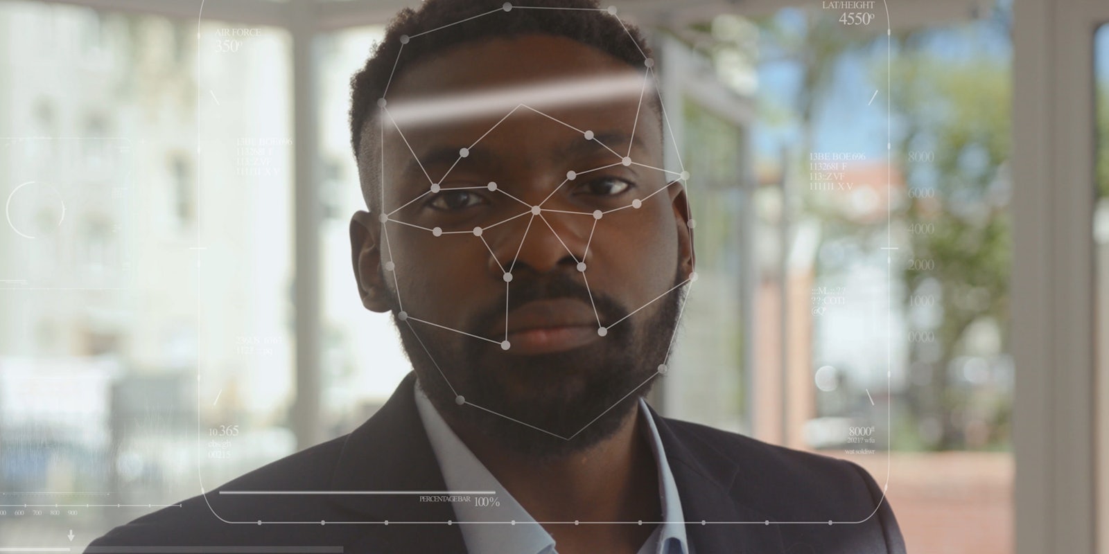 A man being scanned with facial recognition technology.