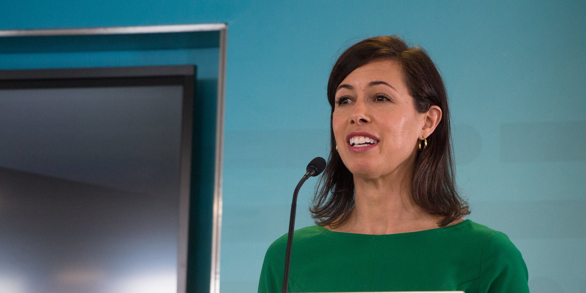 FCC Acting Chairwoman Jessica Rosenworcel speaking at a podium.