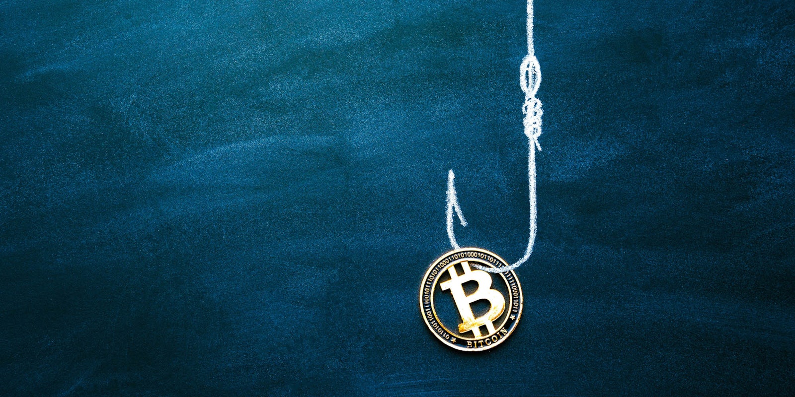 A Bitcoin on the end of a fishing line and hook. It is meant to represent a cryptocurrency scam.