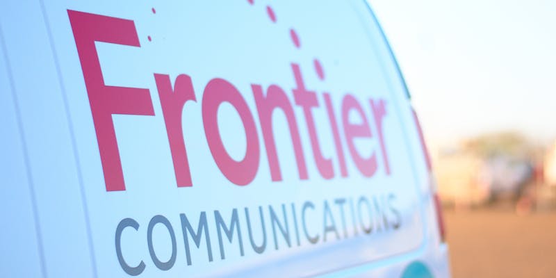  A logo design on the side on a Frontier Communications van.