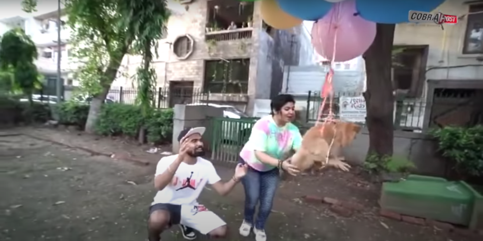 Delhi-based YouTuber Gaurav Sharma and his mom flying their dog by tying several balloons to the dog's waist
