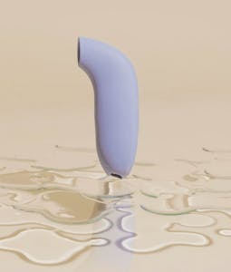 Dame Products' Aer vibrator in a puddle of water