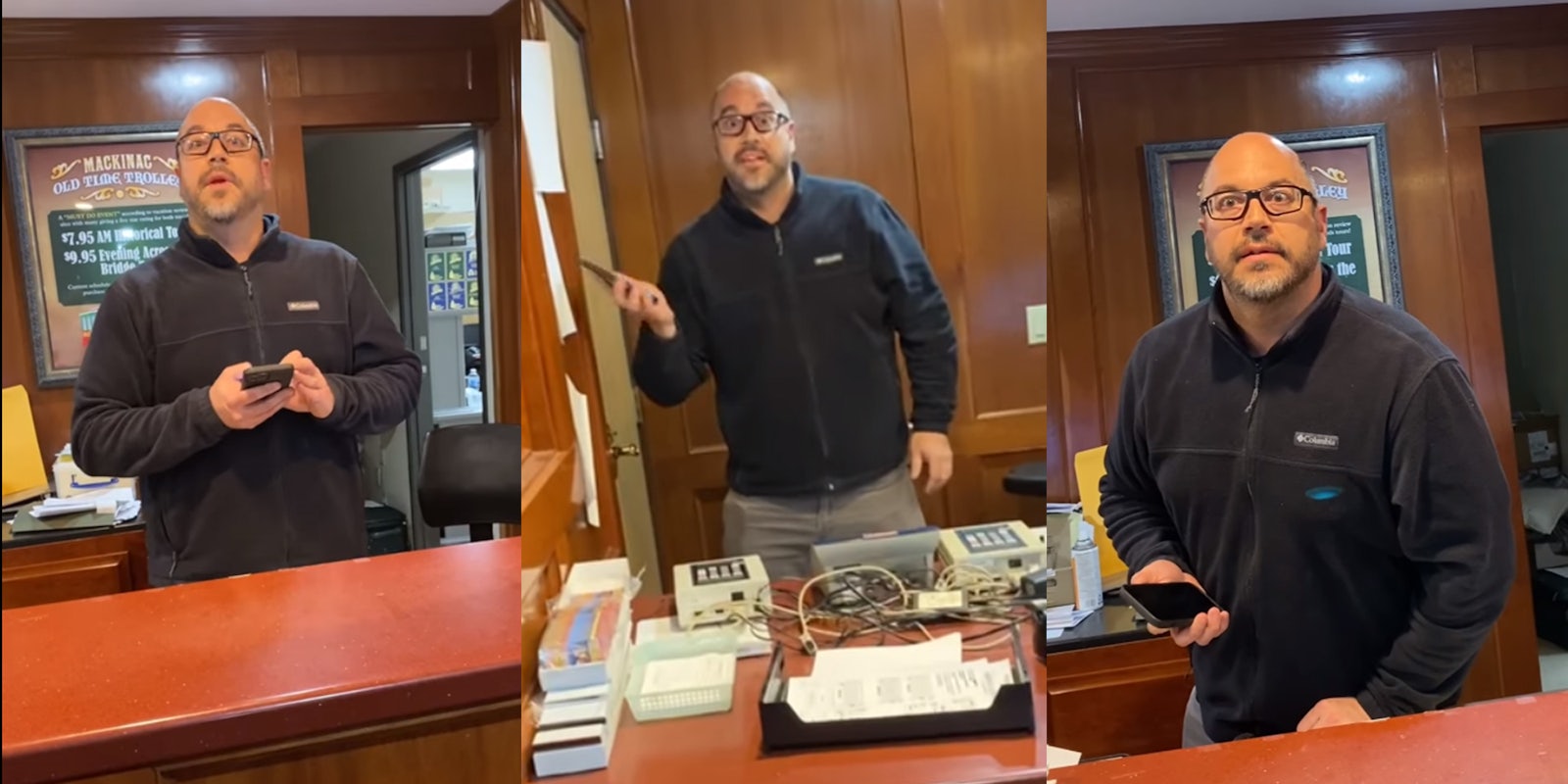 man behind desk uses phone and gestures