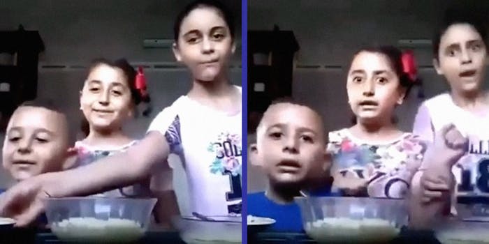 Three children making a cooking video.