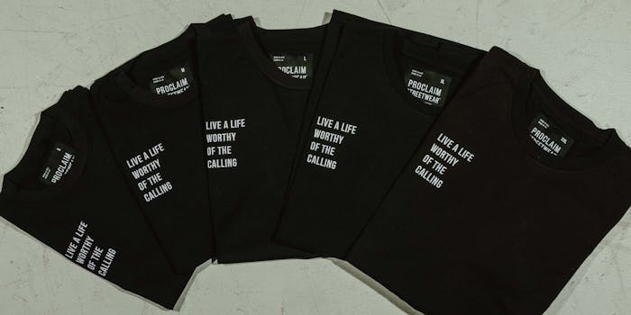 black t-shirts that read "live a life worthy of the calling" in small white letters