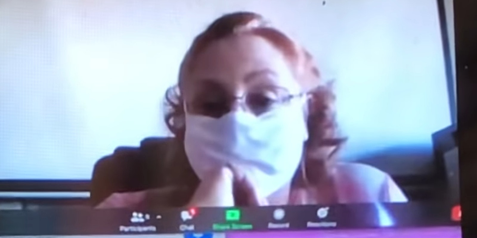 woman in mask on Zoom call