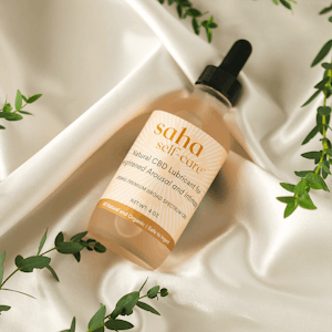 Saha self-care's natural CBD lubricant on a white background.