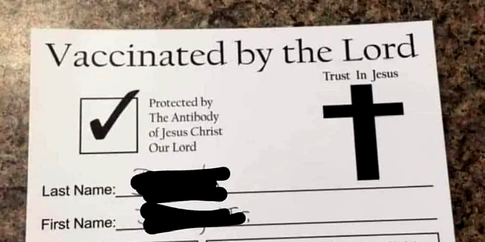 A piece of paper that says 'Vaccinated by the Lord.'