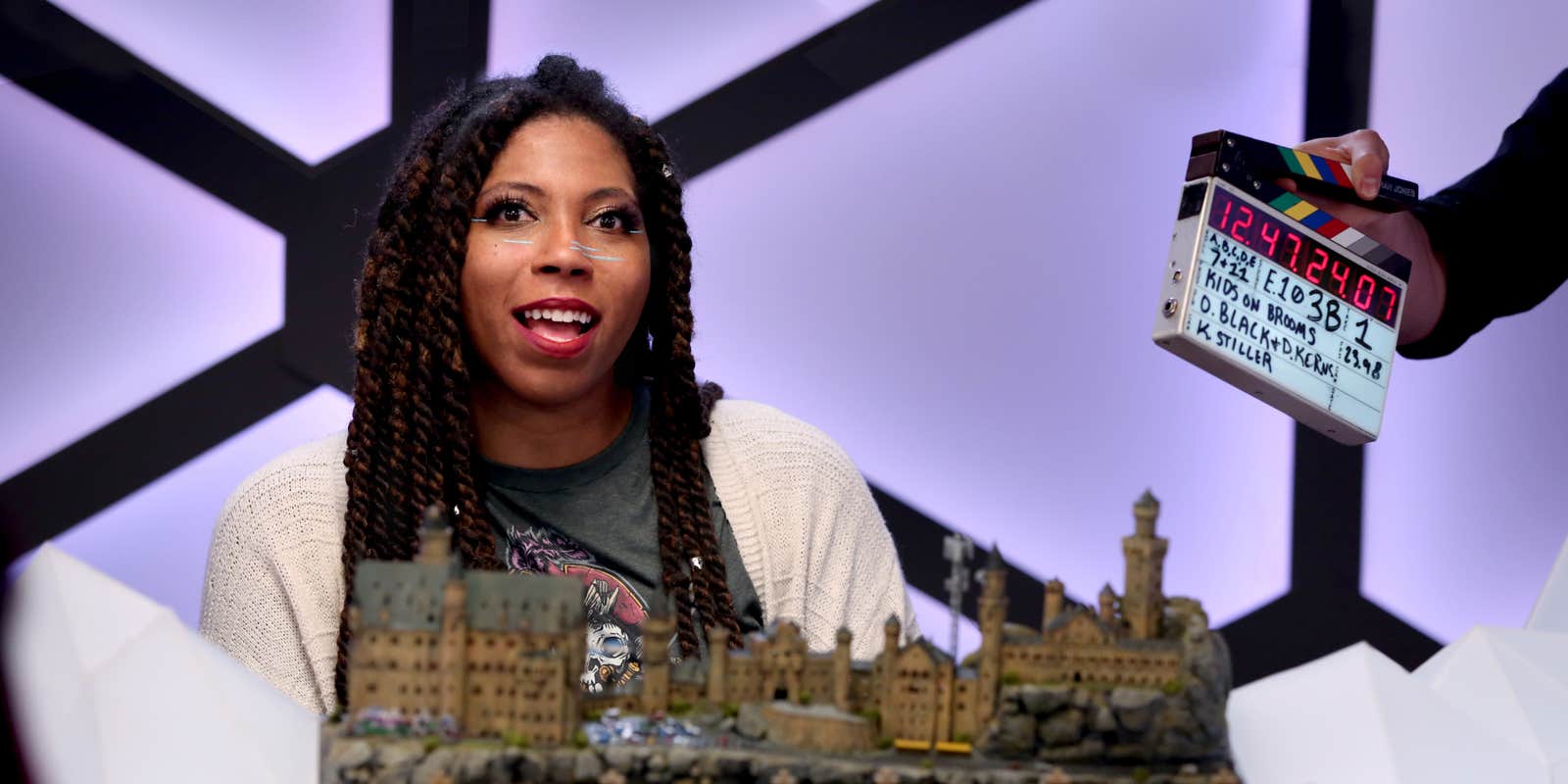 A picture of Aabria Iyengar, the Game Master for Misfits and Magic, at the gaming table.