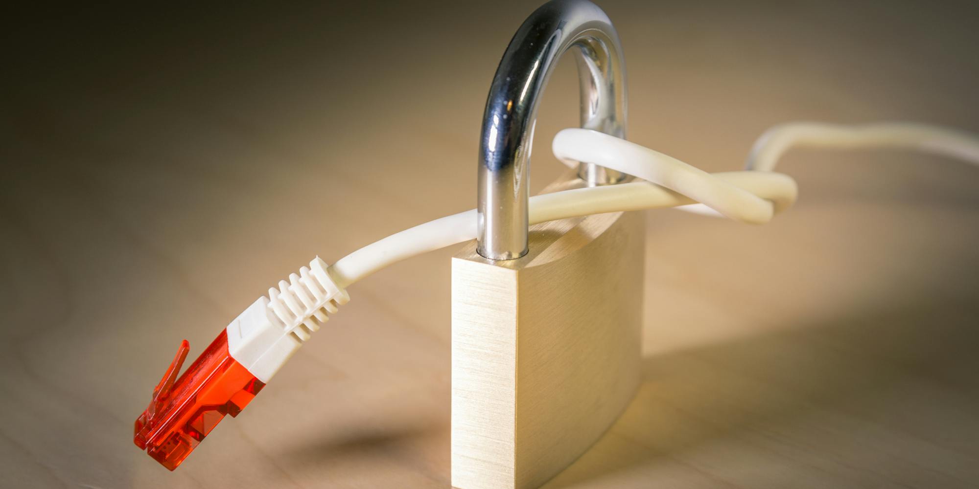 An ethernet cable tied around a standard lock. It is meant to represent net neutrality.