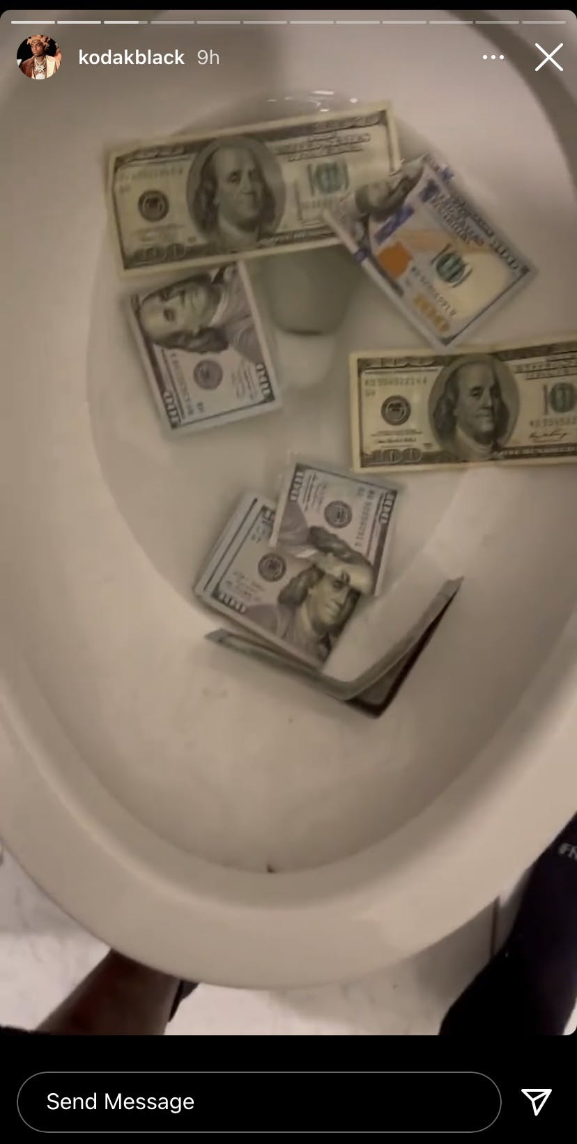 Kodak Black throws $100 bills into the sea and down the toilet