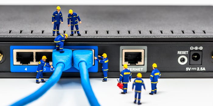 Group of engineer figurines connecting broadband fiber network cables to a router. It is meant to convey closing the digital divide through infrastructure investment.