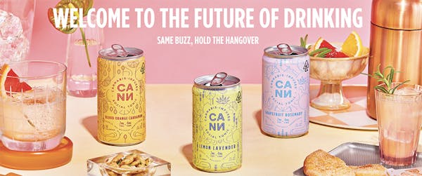 CANN drinks in lemon lavender, orange cardamom, and grapefruit rosemary on a pink background