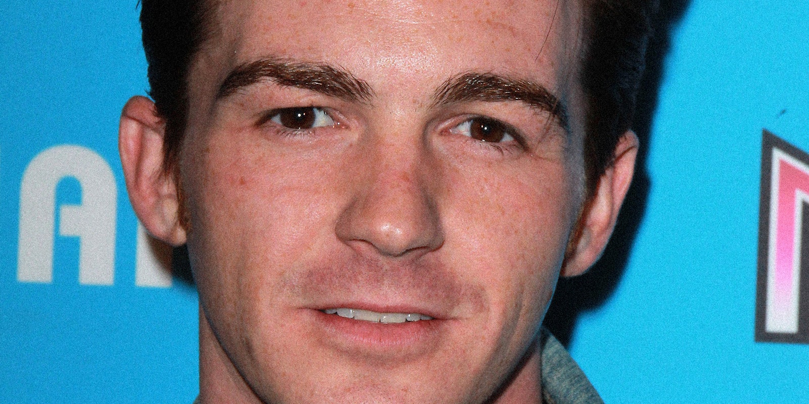 Drake Bell looking into the camera.